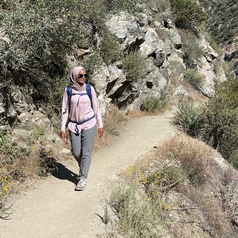Headshot of Sausan, a Goins Lab member at Stanford Medicine, hiking outdoors